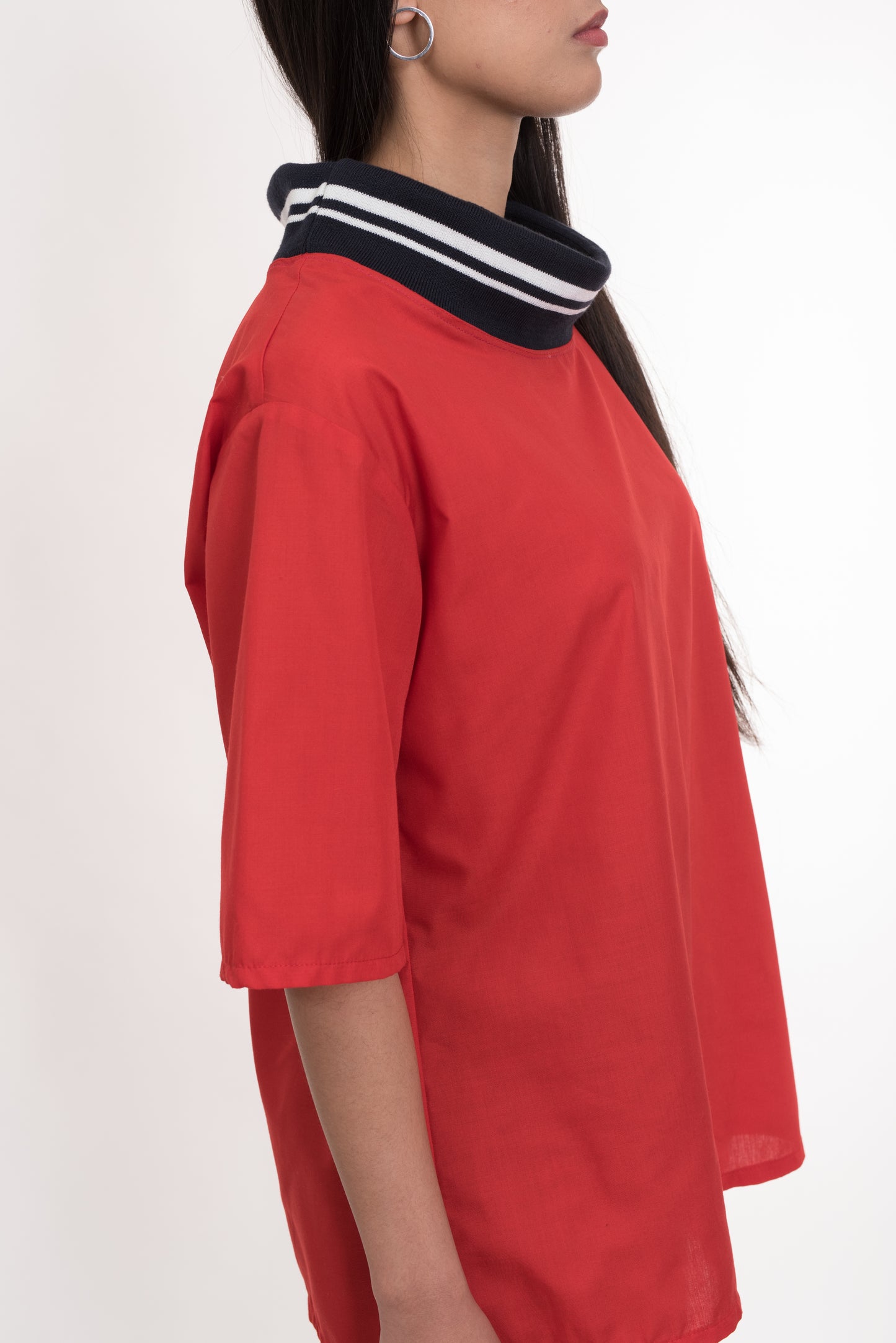 Side profile of model wearing Red Cotton T-Shirt, highlighting striped collar and sleeve detail – Casa Como Boutique