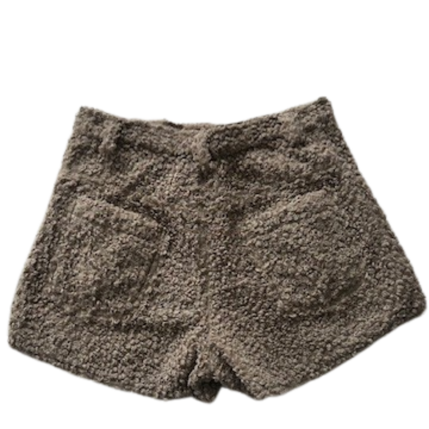 Back view of fuzzy textured shorts in beige showing rear pockets and plush fabric texture.