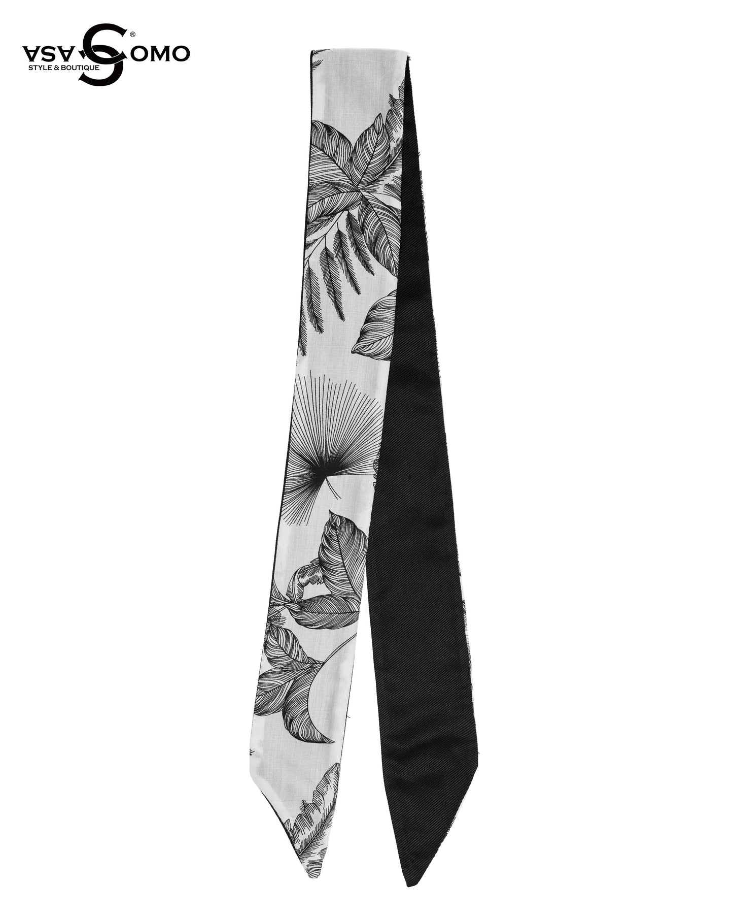 A reversible silk twilly scarf with monochrome tropical leaf print on one side and solid black on the other.