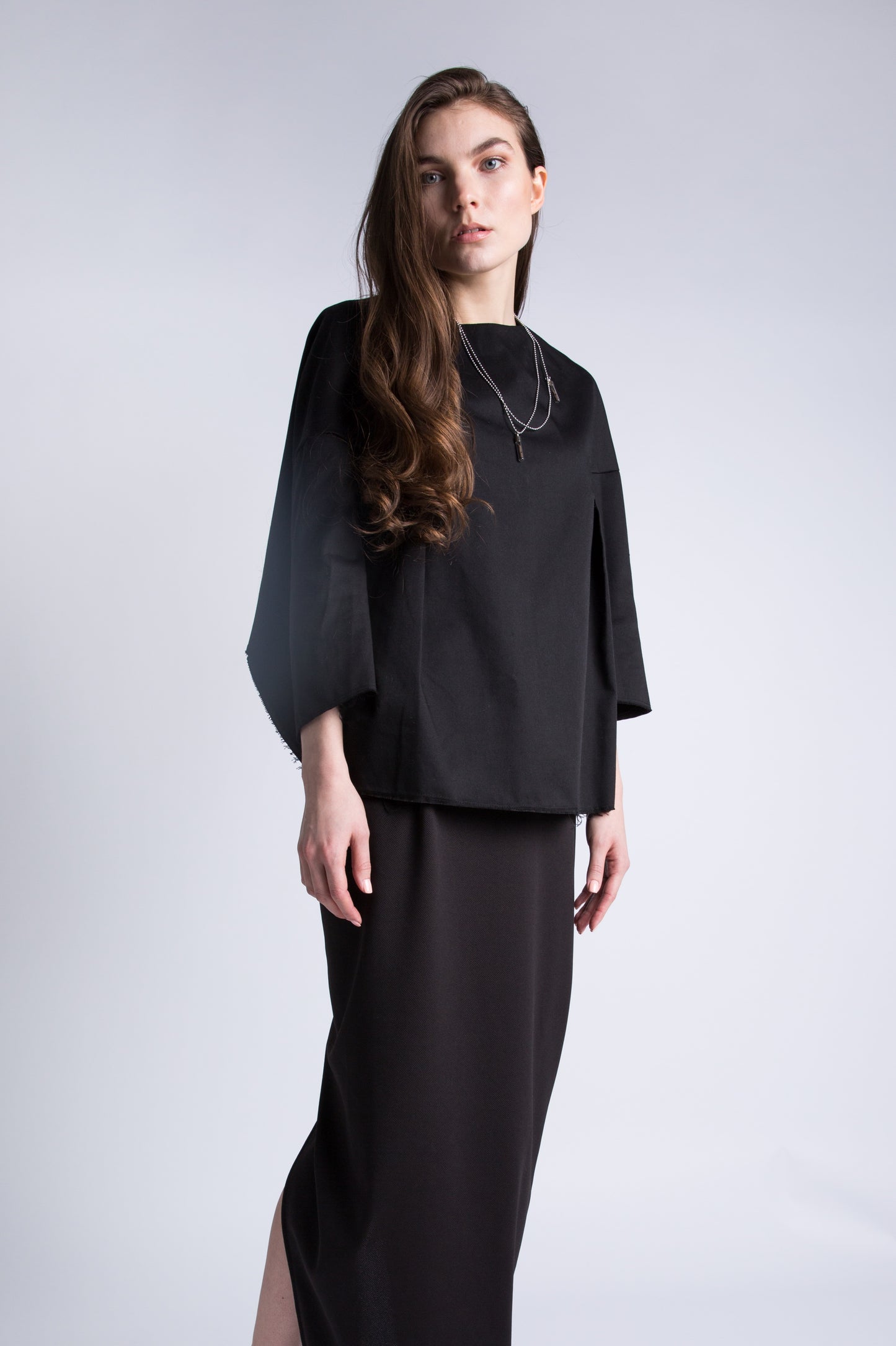 Model wearing black blouse – front angle