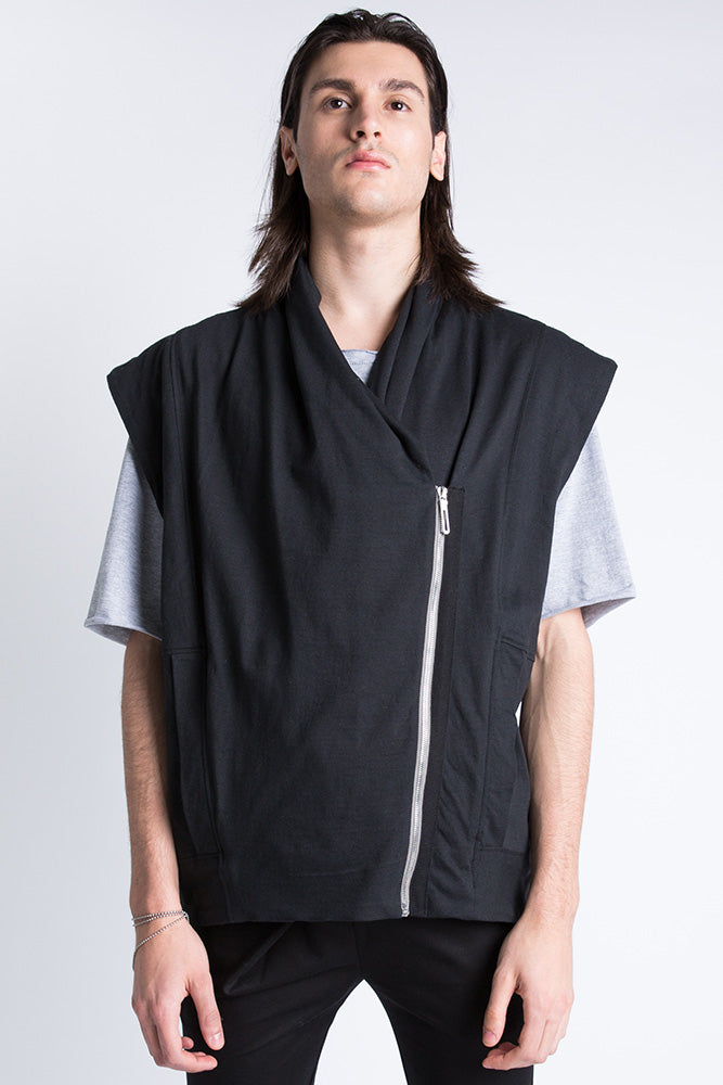 Model wearing black asymmetric vest front view