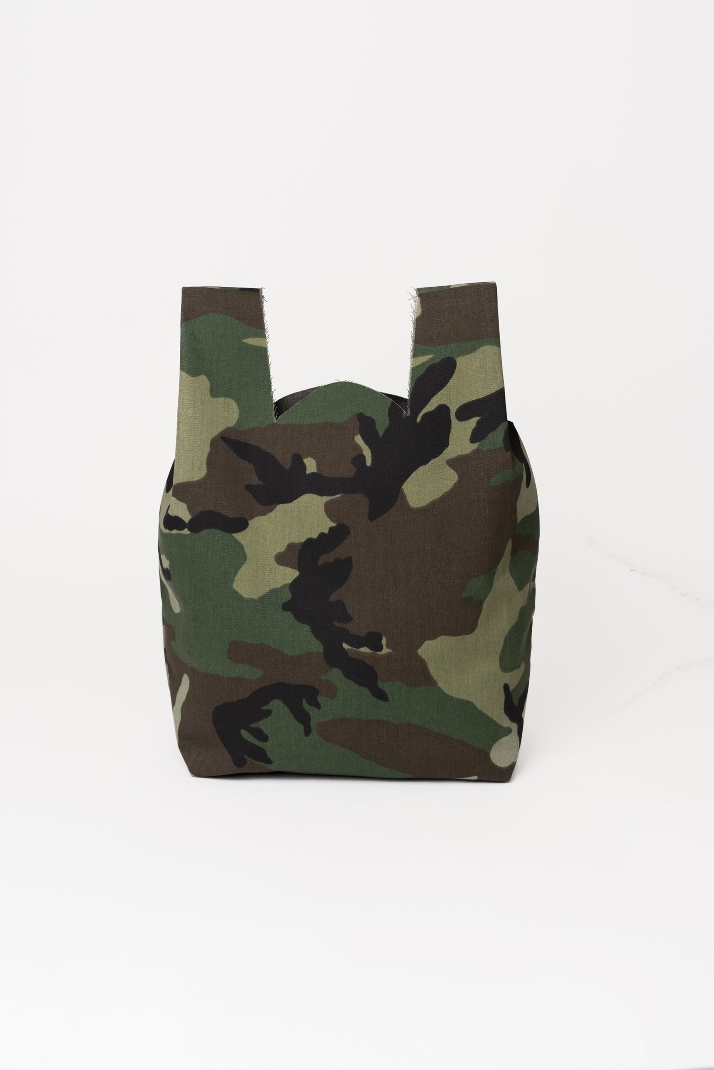 Back view of camo tote bag showing seamless construction.