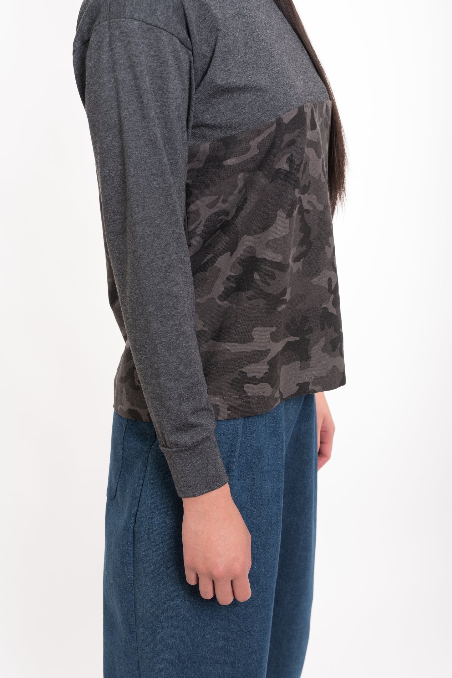 "Close-up of camo and grey block design on streetwear shirt