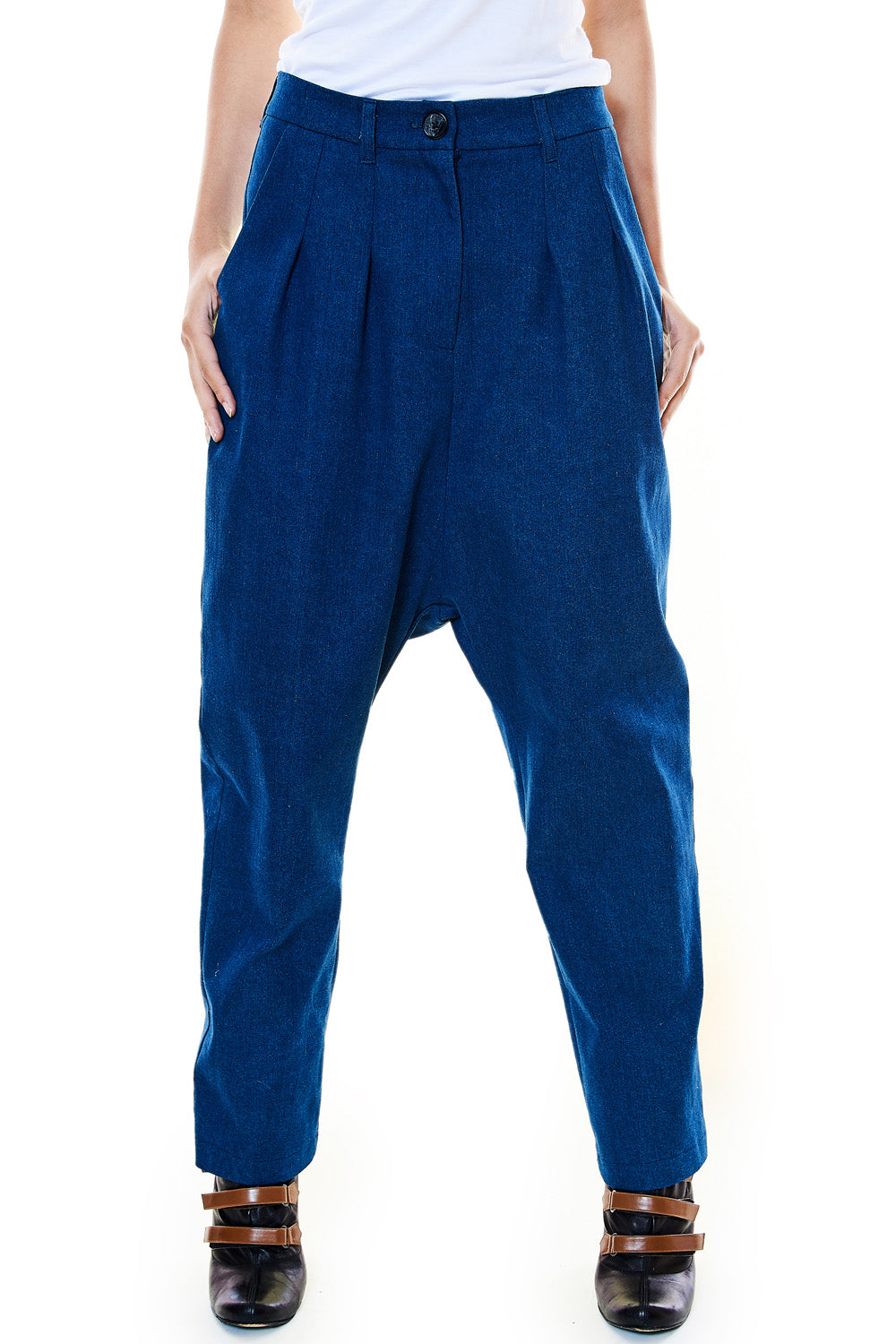 Model wearing drop-crotch blue denim trousers front view