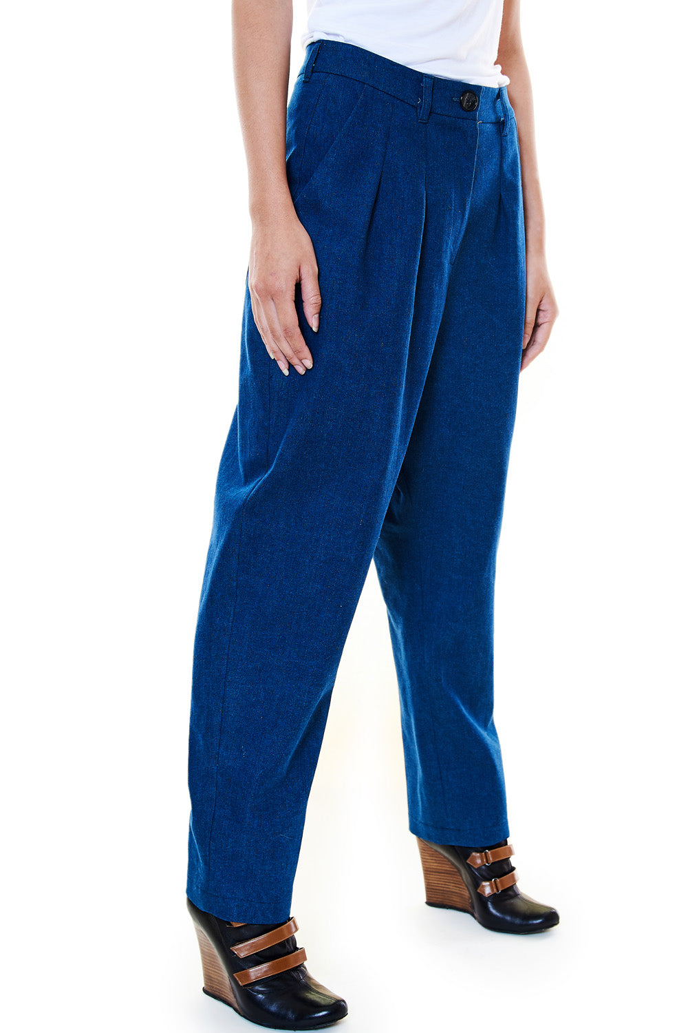 Model side angle in indigo denim trousers
