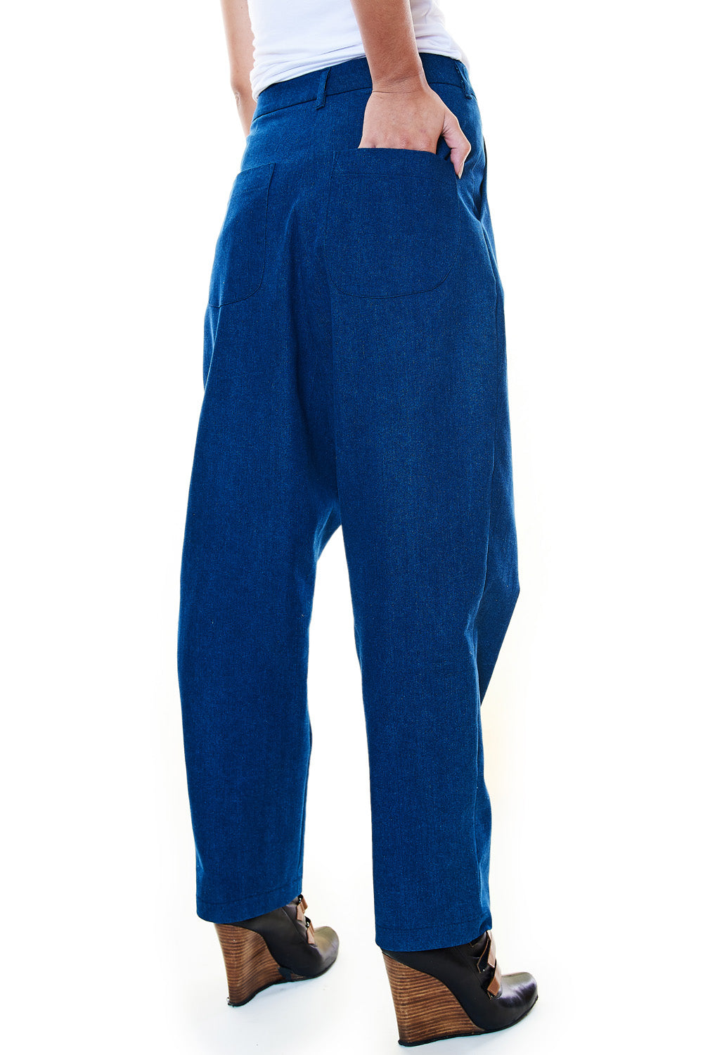 Rear pocket detail of tapered drop-crotch denim pants