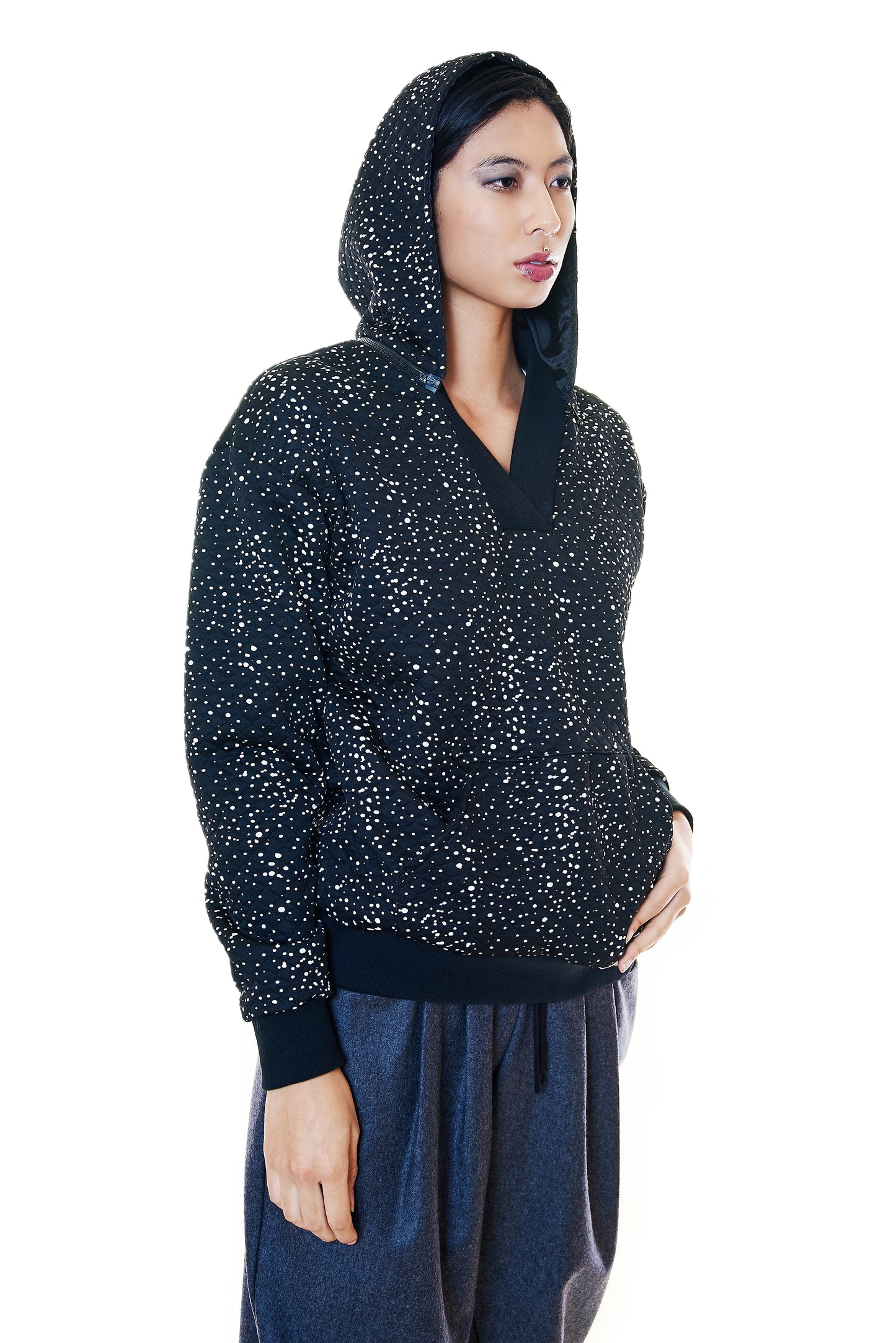Side angle of quilted hoodie with dotted pattern styled with wide-leg pants – Casa Como Boutique