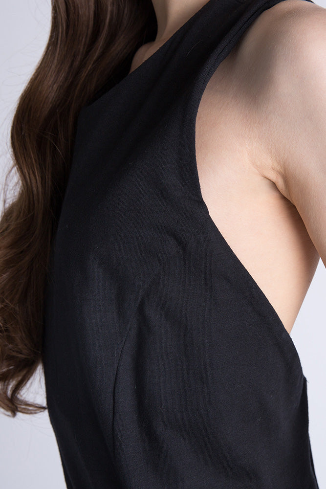 "Close-up of side cut and armhole on black racerback maxi dress, showing texture and fit.