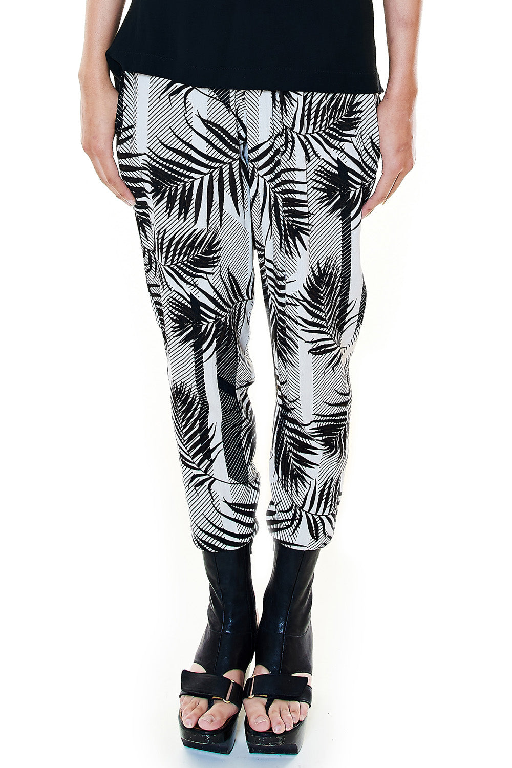 Front view of black and white palm printed jogger pants
