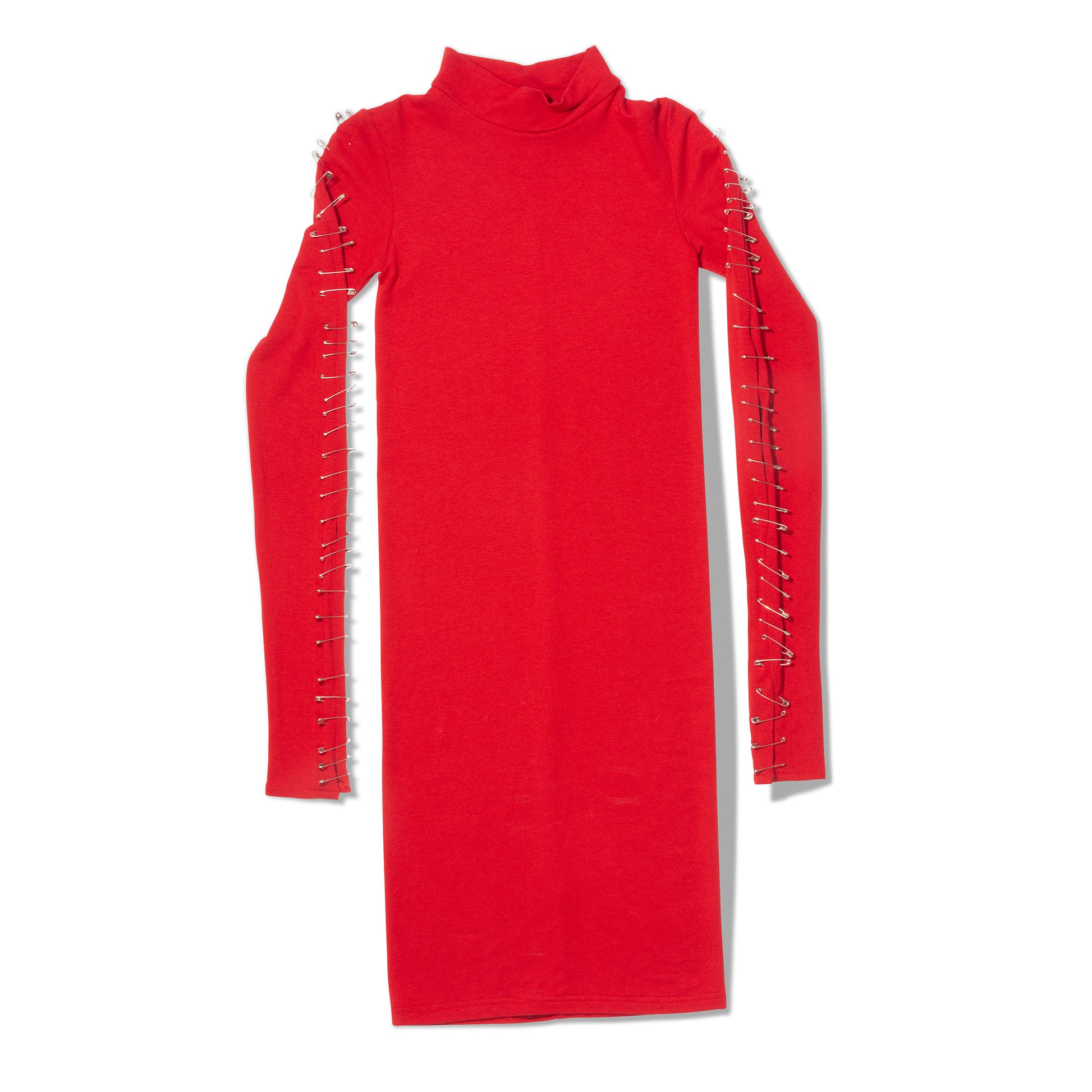 Flat lay of red dress with safety pins down the sleeves