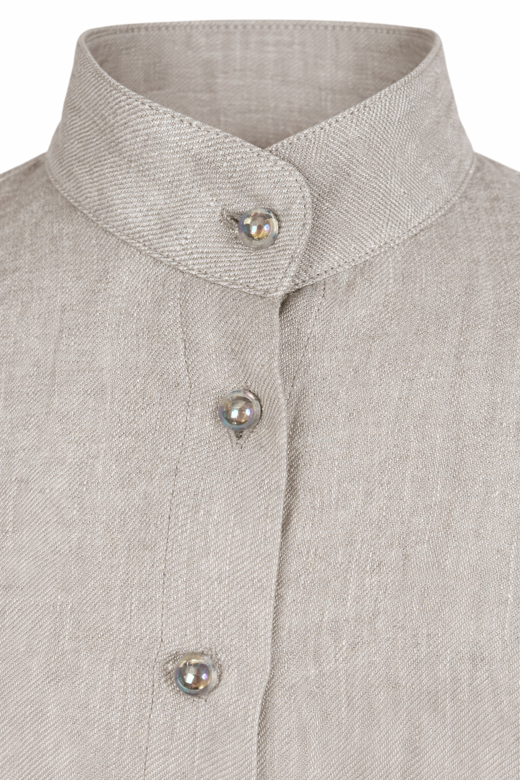 Close-up detail of iridescent mother of pearl buttons on Casa Como linen mandarin collar blouse