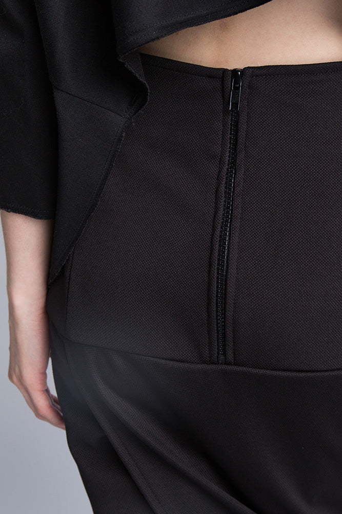 "Close-up of zipper detail on black skirt waist